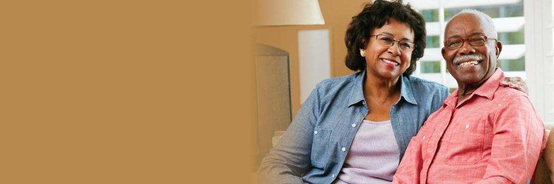 Older couple smiling at dentist office in Greeley CO