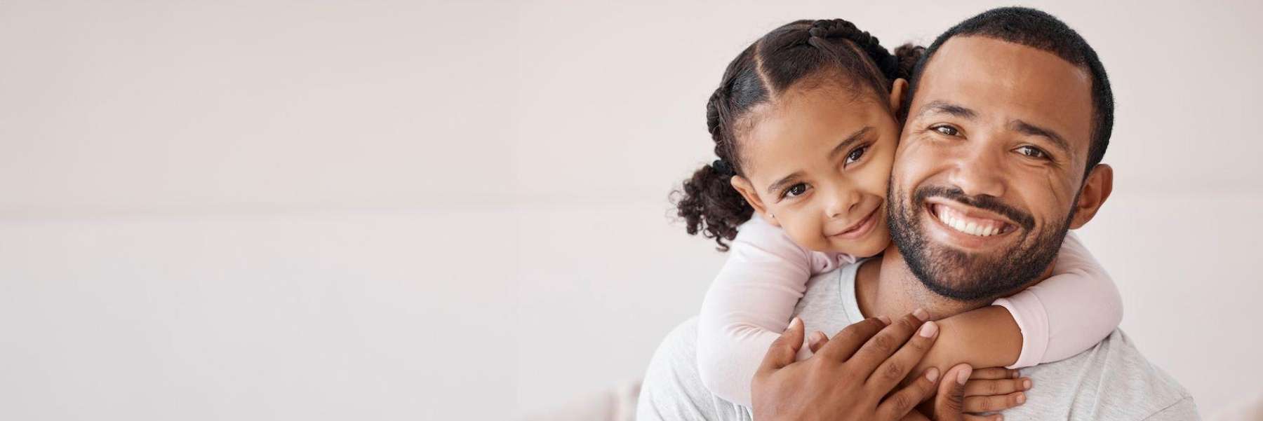 A father and daughter embracing | family dentist Greeley