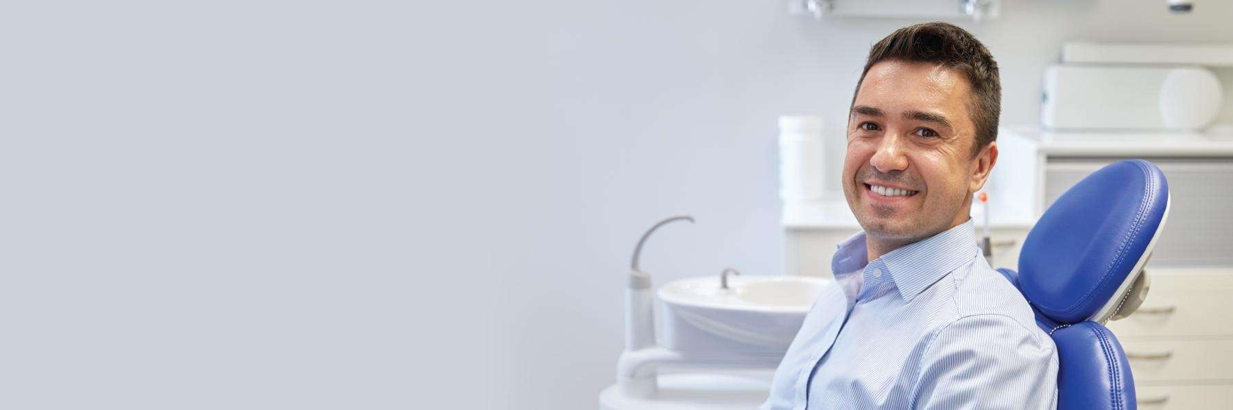 A smiling man at the dentist
