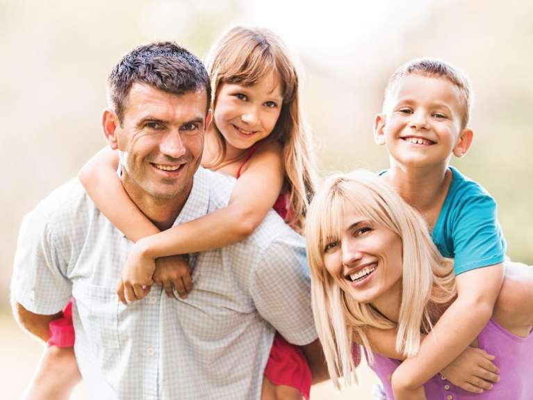 Two parents and two kids at a picnic