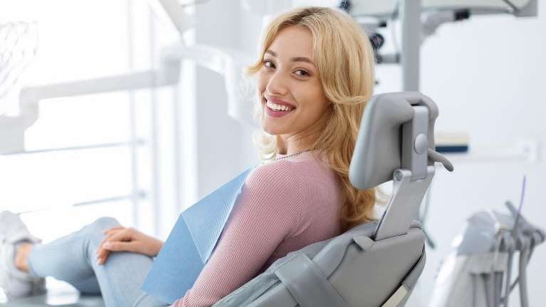 A smiling woman at the dentist