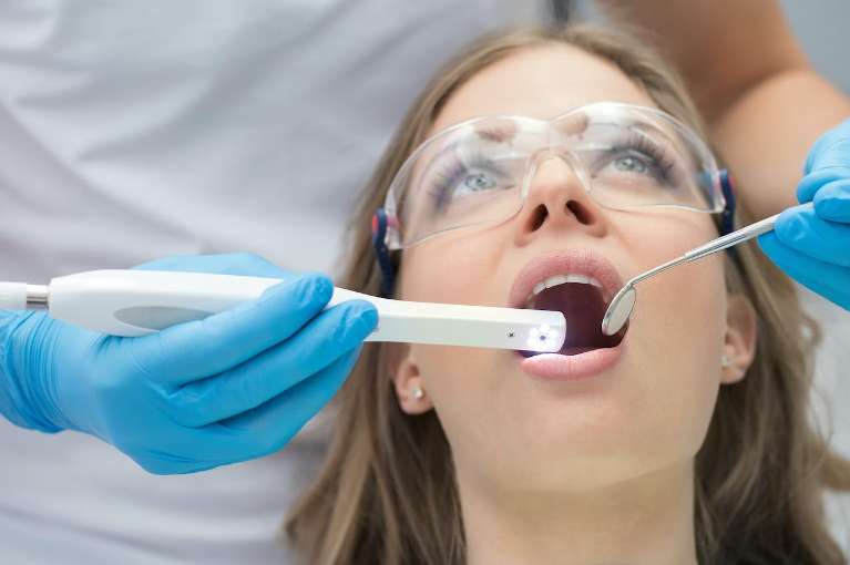 A woman receiving a dental exam