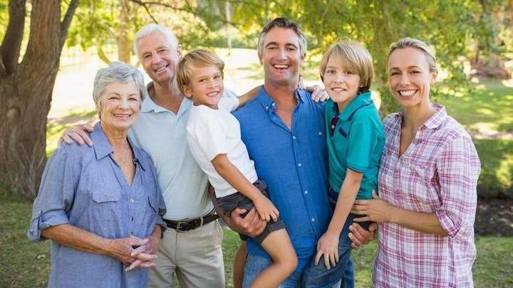 A smiling family at the park 
