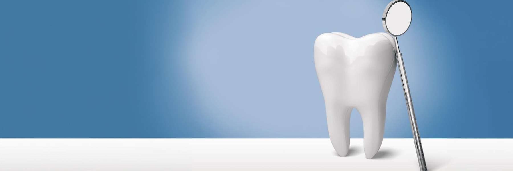 An illustration of a tooth and a dental mirror