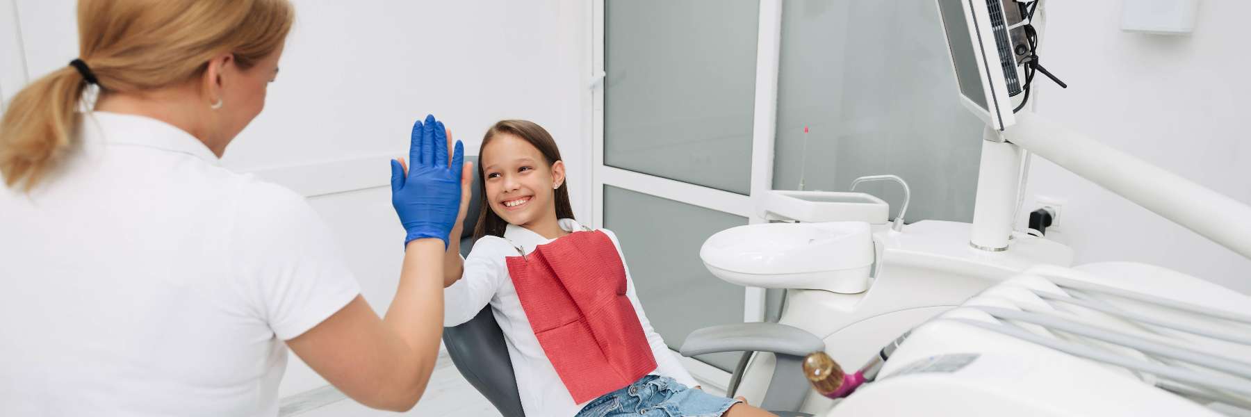 Child sitting in a dental chair