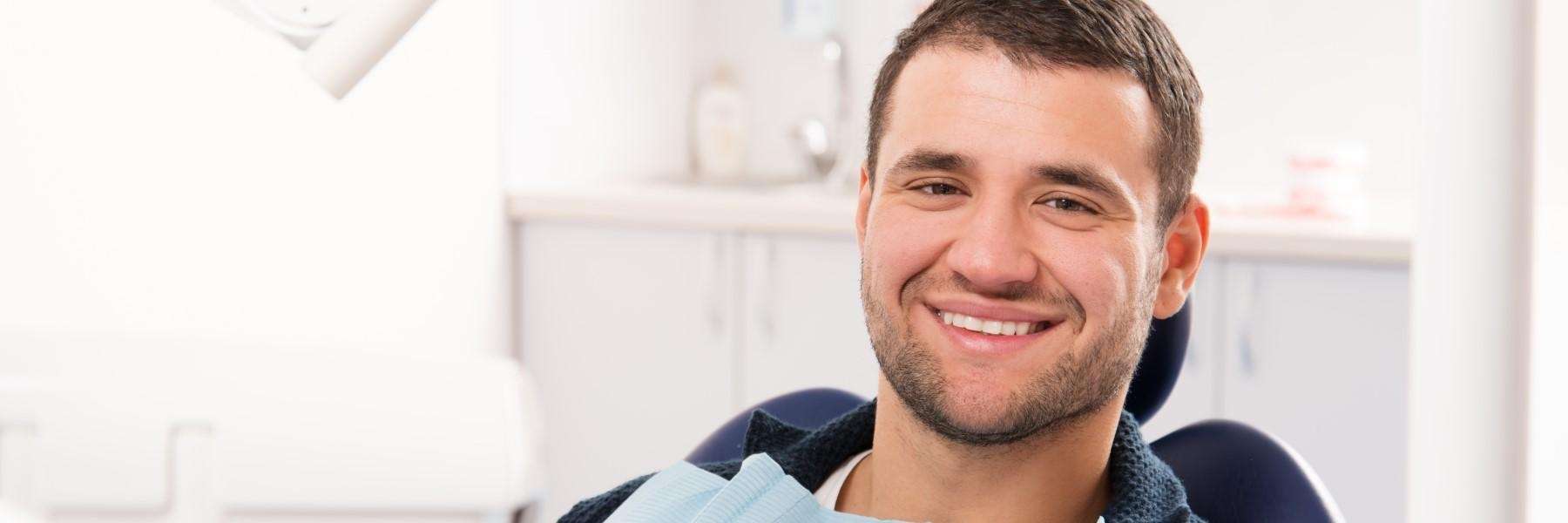 man sitting in dental chair