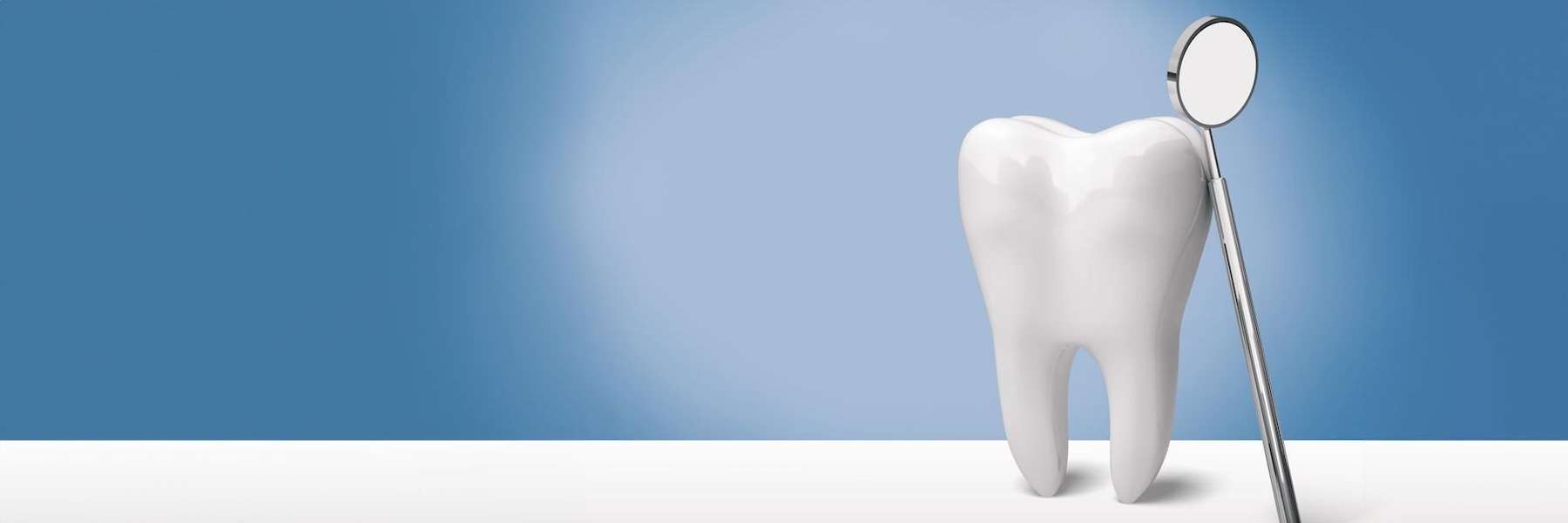 An illustration of a tooth and a dental mirror